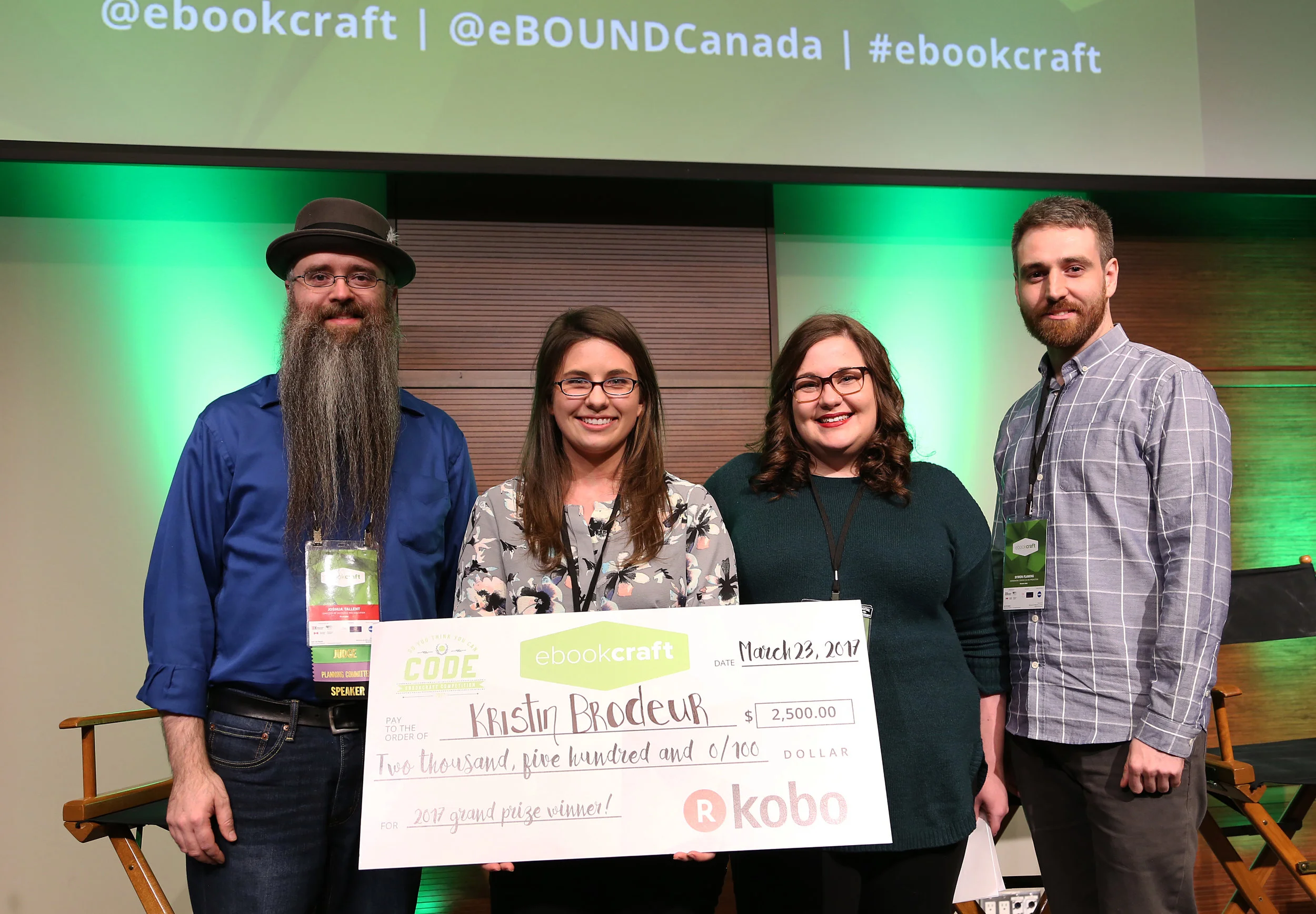   L-R: Joshua Tallent, judge, Kristin Brodeur, winner, Monique Mongeon, judge, Symon Flaming, Kobo representative. Photo by Yvonne Bambrick.  