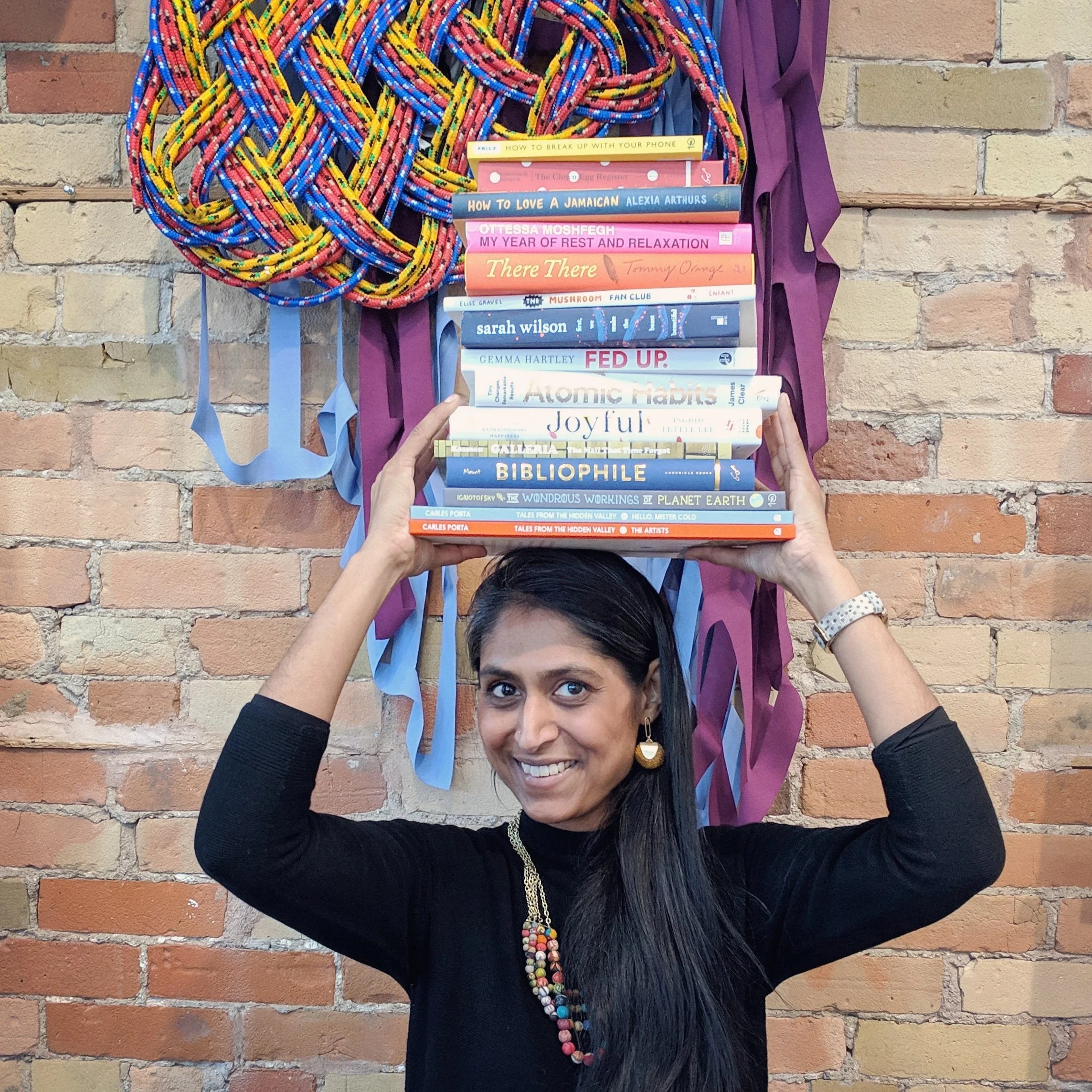 Kalpna is holding over 10 books on her head