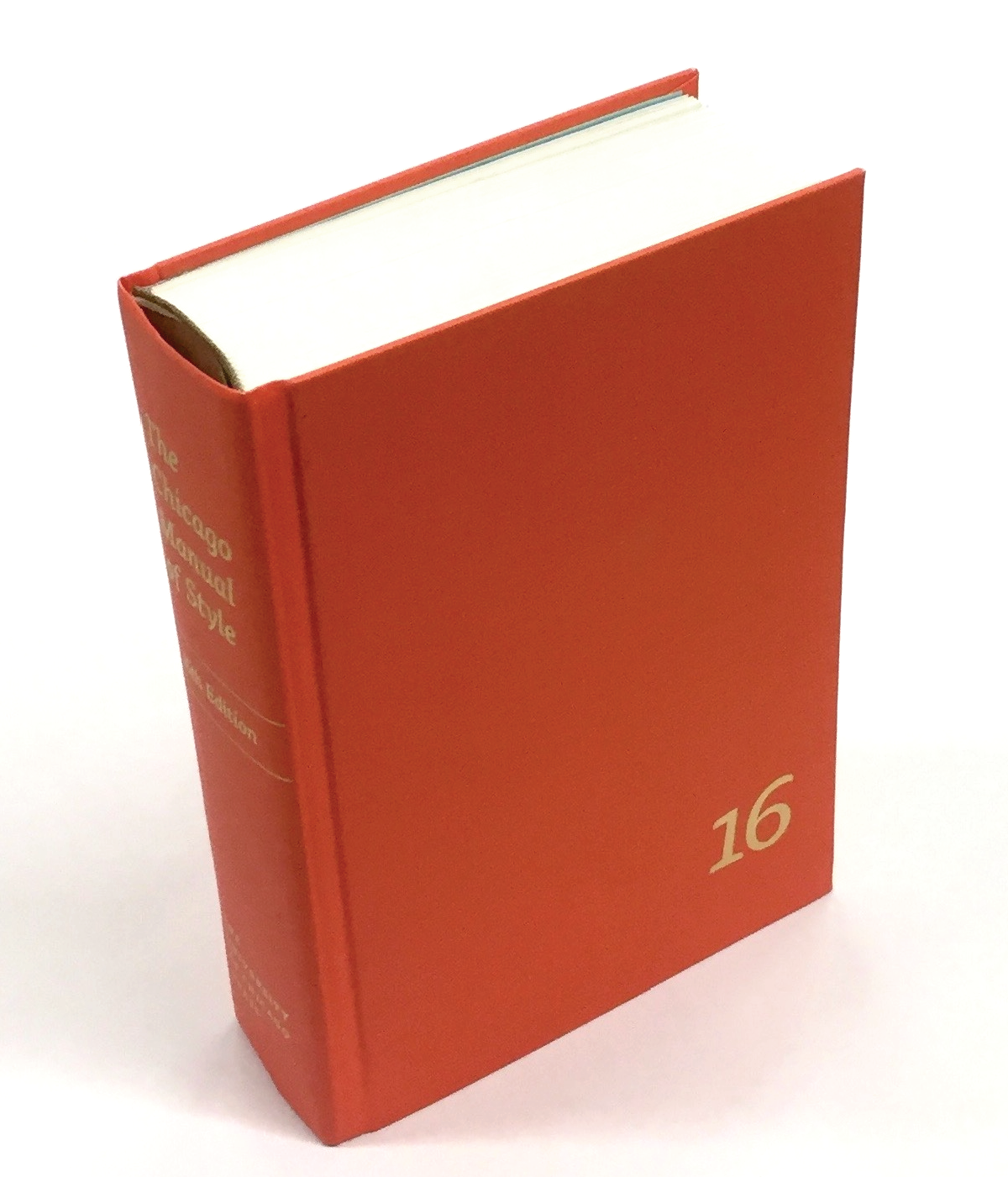 A photo of an orange hardcover book.